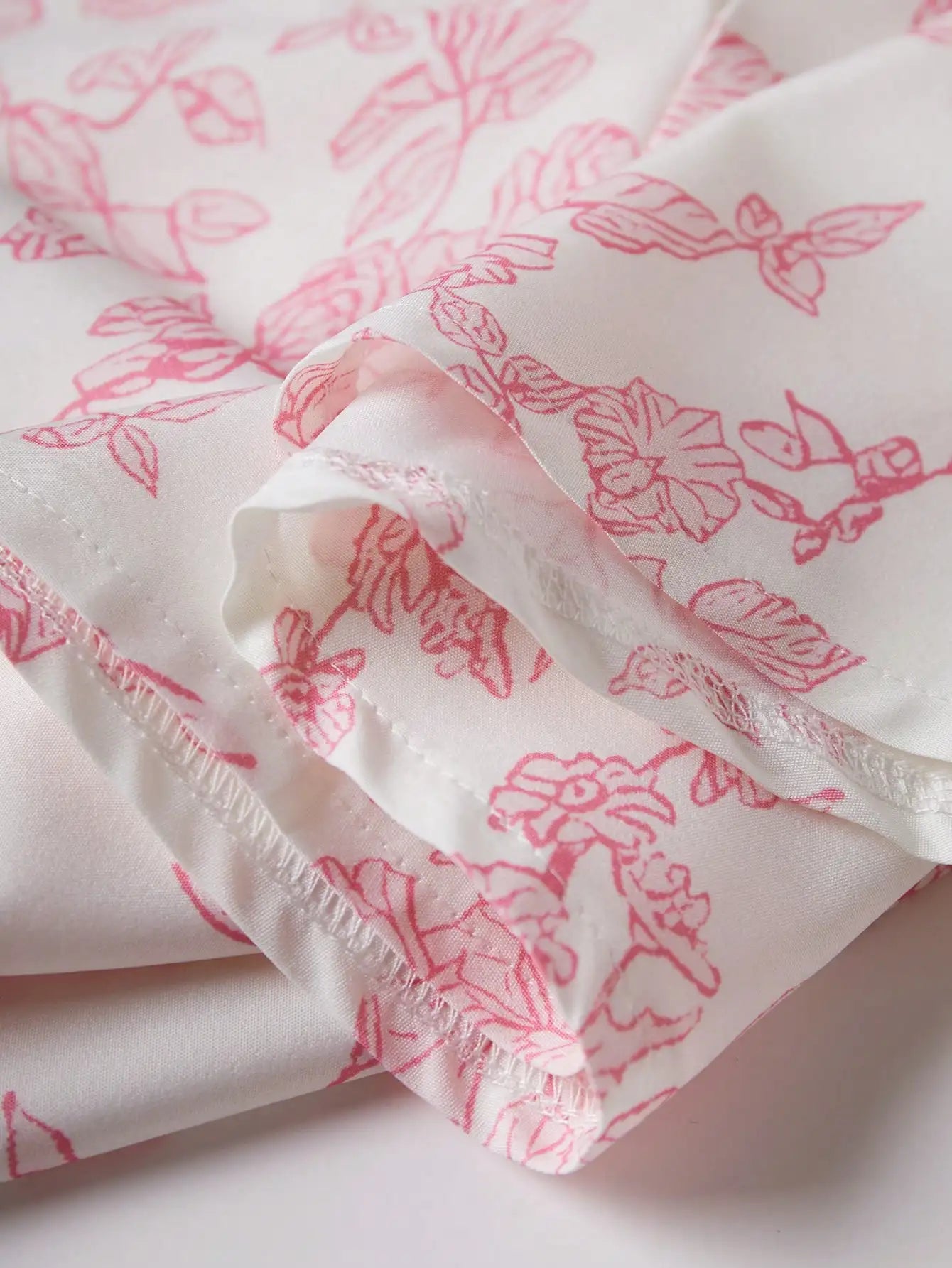Elegant Pink Floral Print Dress with Thin Straps and a Flared Waist