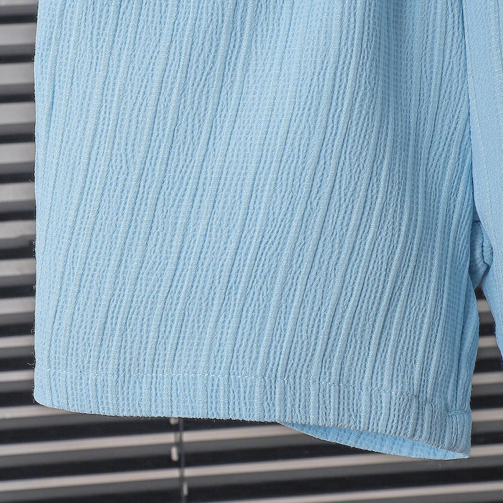 New summer men's short-sleeved woven pure blue button pocket + loose shorts two-piece set